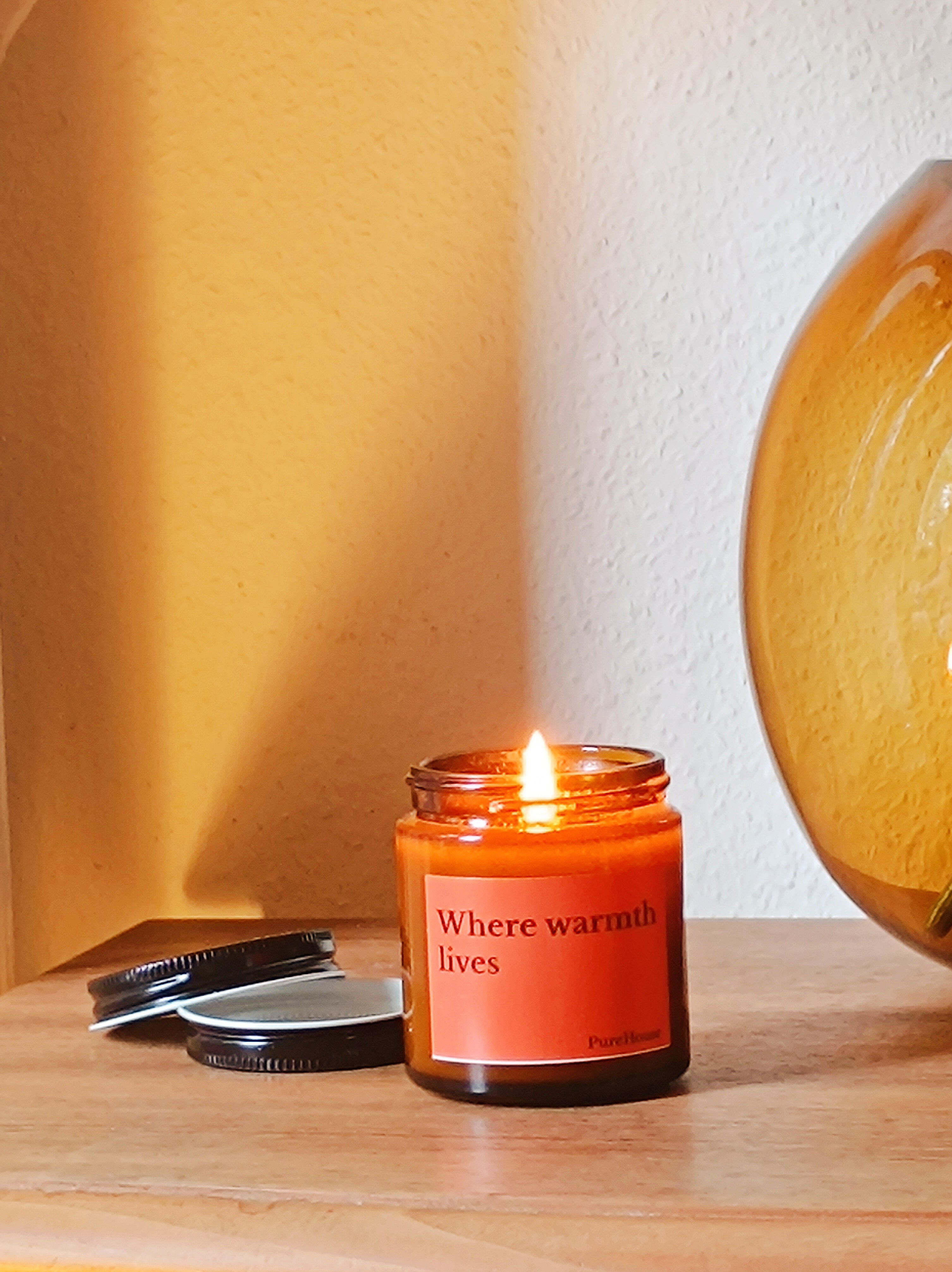 Where warmth lives Soy Candle | Amber Jar with Black lid